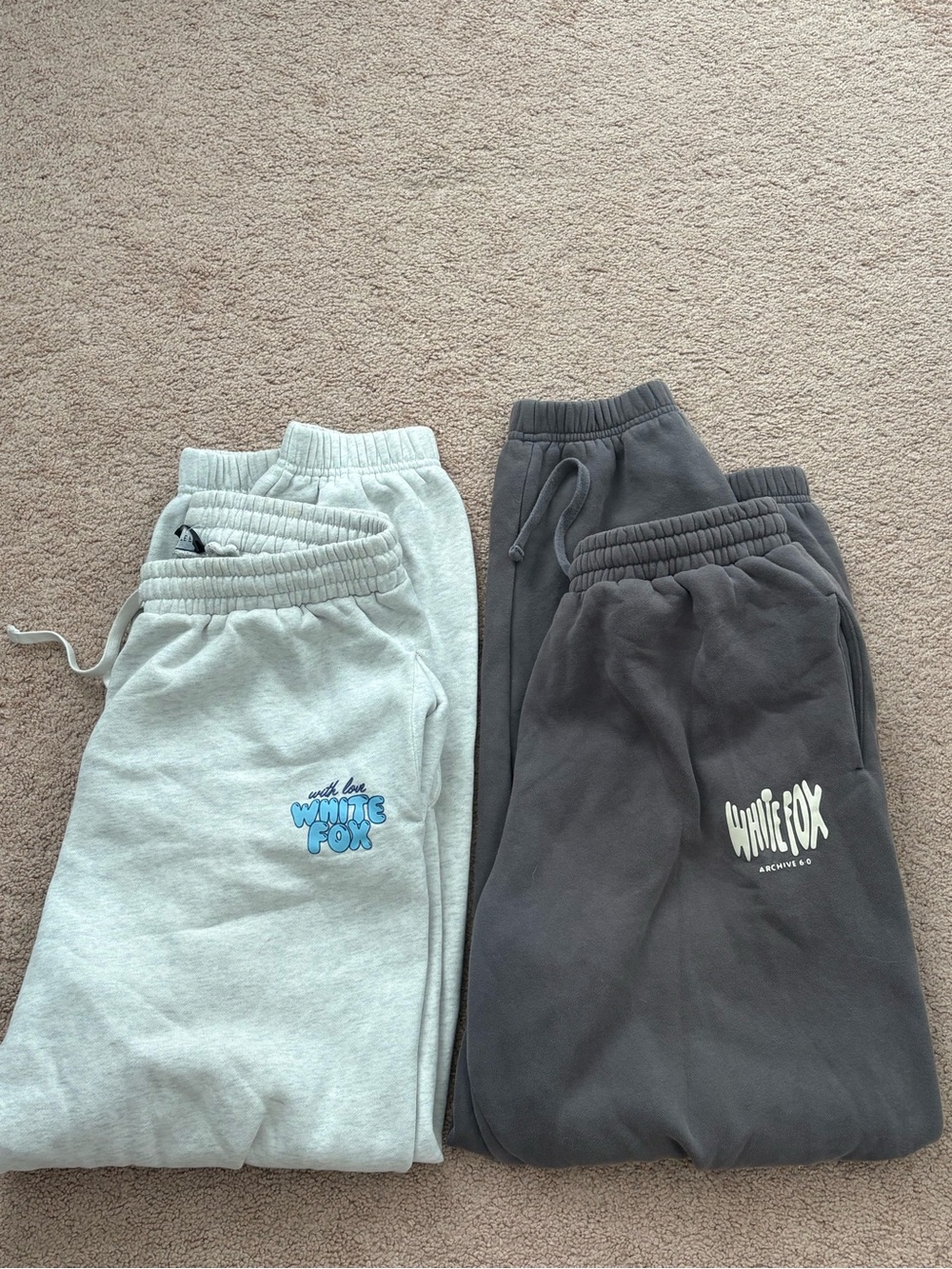 2 pairs of white fox sweatpants